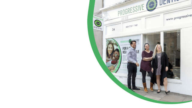 dr nissit patel and the team standing outside progressive dentistry dental practice in fulham