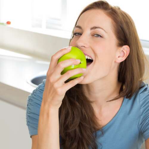 women biting an apple