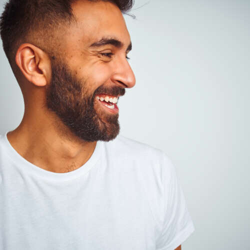 man smiling after composite bonding treatment