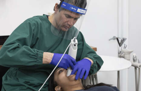 a patient receiving laser treatment from dr nissit patel at progressive dentistry