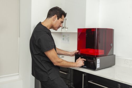 Dr Patel with the 3d printer