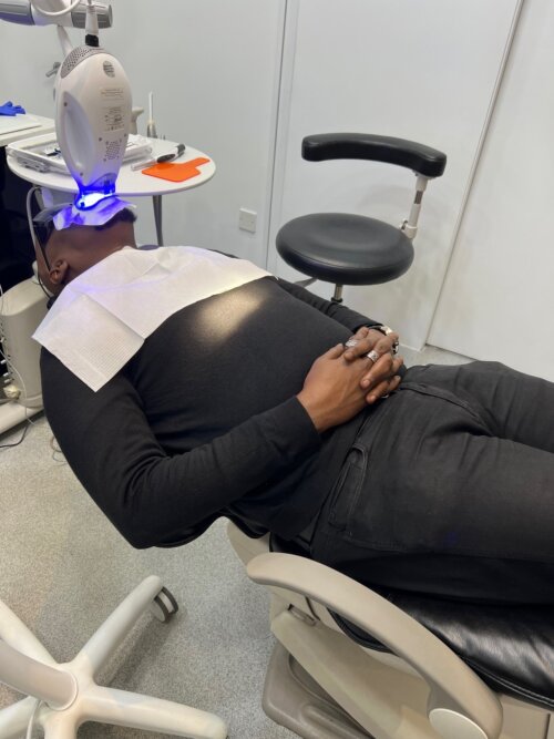 Patient receiving philips zoom led dental treatment