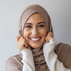 Women with head scarf smiling close up
