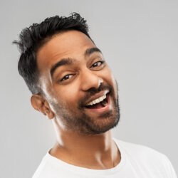 Young man smiling with black hair